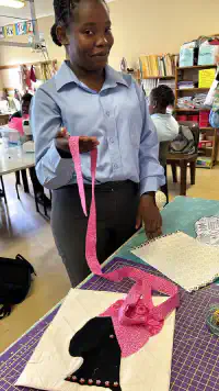 School boy with quilt